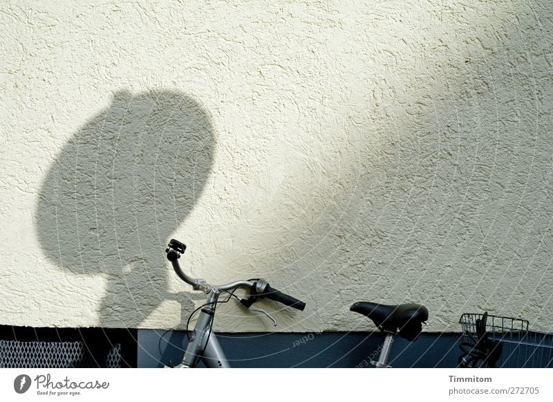 Karl in Monnem: Blues Mannheim Wall (barrier) Wall (building) Bicycle Concrete Metal Stand Firm Gray Black White Emotions Calm Shadow Lean Colour photo