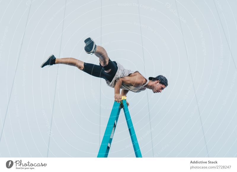 Man balancing on ladder Balance Handstand Acrobatic Athletic Sports Breakdance Posture flexibility Youth (Young adults) pose Power Aerobics gymnastic skill