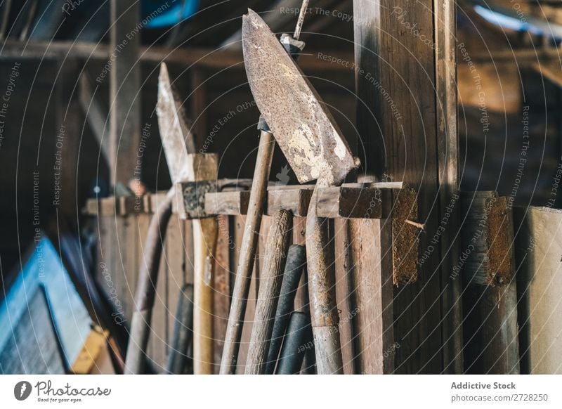 Rusty spades in warehouse Barn Agriculture Shovel Rural tools Equipment Wood Gardening Farmhouse Landscape Old Rustic instruments Interior design