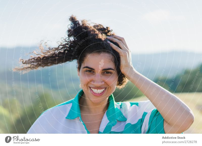 Woman touching hair Nature Hair Beautiful pretty Portrait photograph Curly Attractive Cute African Human being Brunette Easygoing Smiling Cheerful Touch