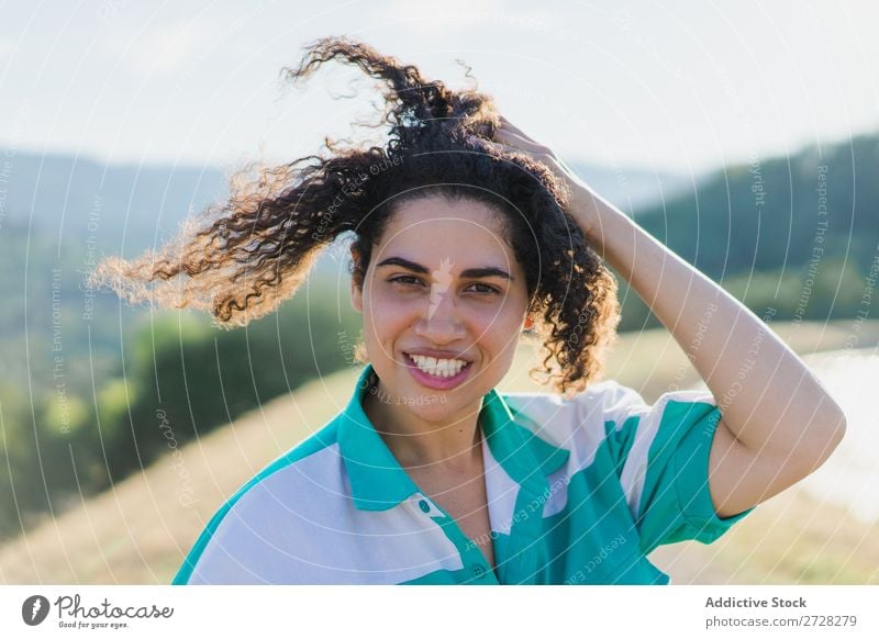 Woman touching hair Nature Hair Beautiful pretty Portrait photograph Curly Attractive Cute African Human being Brunette Easygoing Smiling Cheerful Touch