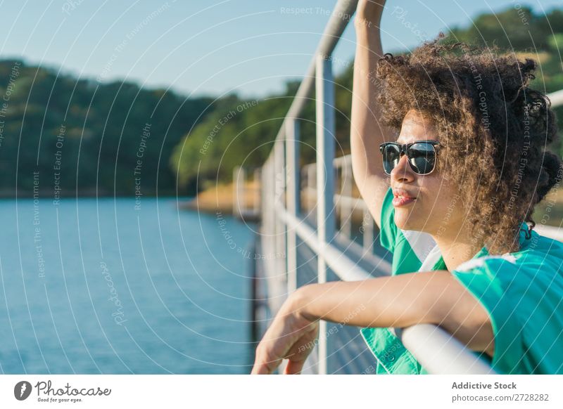 Beautiful woman on pier Woman Jetty Water Nature Youth (Young adults) Summer Ocean Sky Vacation & Travel Relaxation Lake Leisure and hobbies Human being