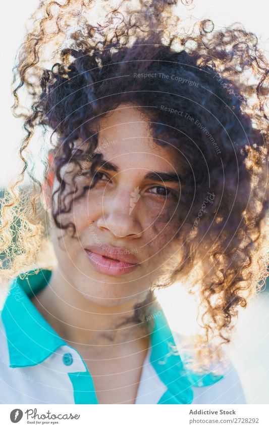 Curly woman posing on nature in sunlight Woman Summer To enjoy Posture human face Landscape Nature Colour Portrait photograph tranquil Exterior shot Countries