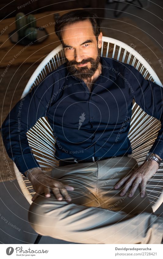 Portrait of a mature man sitting on the chair posing thoughtful Portrait photograph Chair Man Mature Old Seat Beard Unshaven Conceptual design Well Dressed