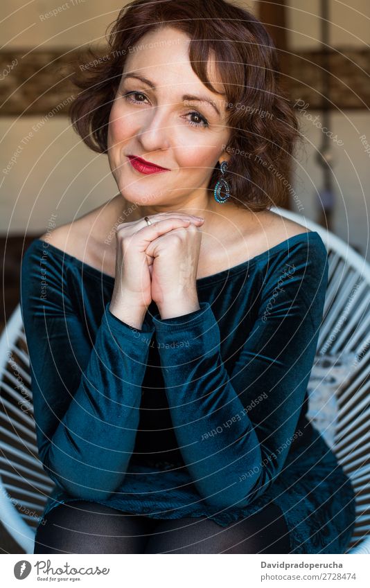 Portrait of a mature woman sitting on the chair posing thoughtful Portrait photograph Woman Red-haired Mature Old Human being Senior citizen Face Earnest