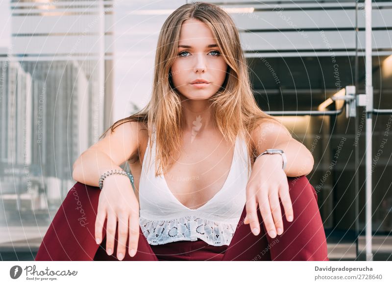 Beautiful young woman sitting in the stairs posing Woman Blonde Sit Stairs Exterior shot sits Youth (Young adults) Steps Beauty Photography City Town