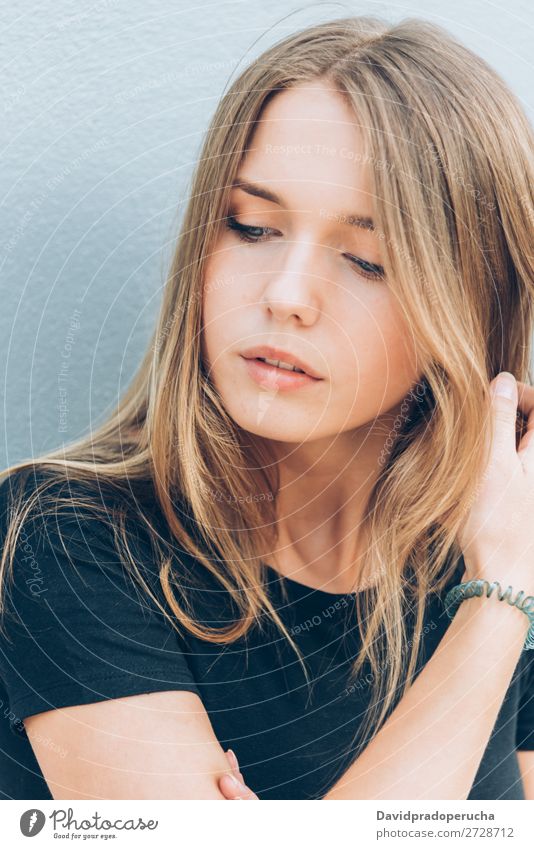 Close up portrait of a beautiful young woman Woman Blonde Portrait photograph Considerate Face Girl Loneliness White Sadness Black Smiling Beautiful