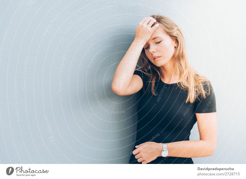 Close up portrait of a beautiful young woman Woman Blonde Considerate Face Girl Loneliness Portrait photograph White Sadness Black Smiling Beautiful