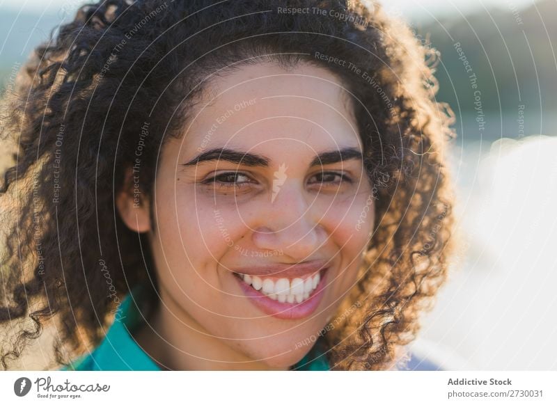 Curly woman posing on nature in sunlight Woman Summer To enjoy Posture human face Landscape Nature Colour Portrait photograph tranquil Exterior shot Countries