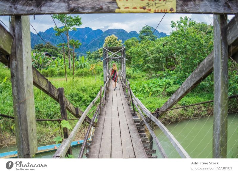 Woman walking in wooden bridge Virgin forest Bridge Wood Hanging Landscape Nature Vacation & Travel Forest Tropical Mystery Footbridge Footpath romantic