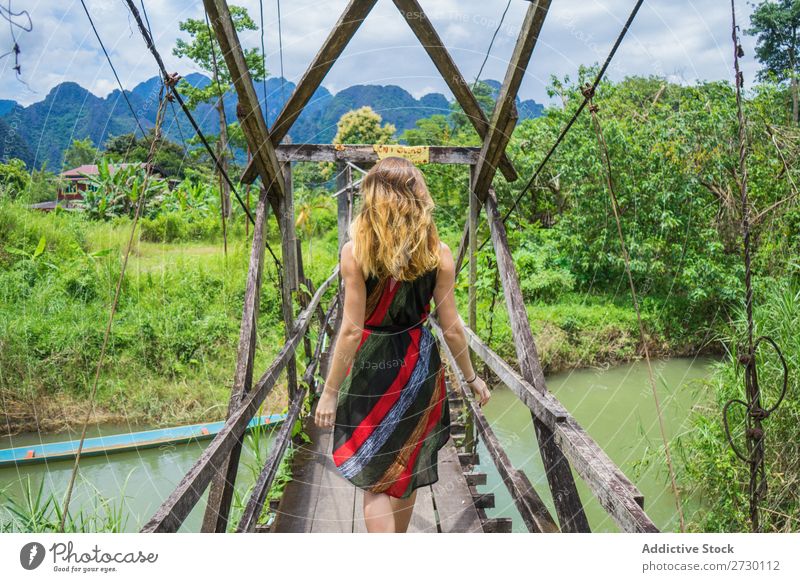 Woman walking on bridge Virgin forest Bridge Wood Hanging Landscape Nature Vacation & Travel Forest Tropical Mystery Footbridge Footpath romantic Construction