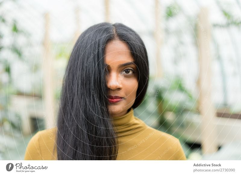 Pretty Indian ethnic woman in greenhouse Woman pretty Greenhouse Nature Style Looking into the camera Ethnic Plant Gardener Beautiful Youth (Young adults)