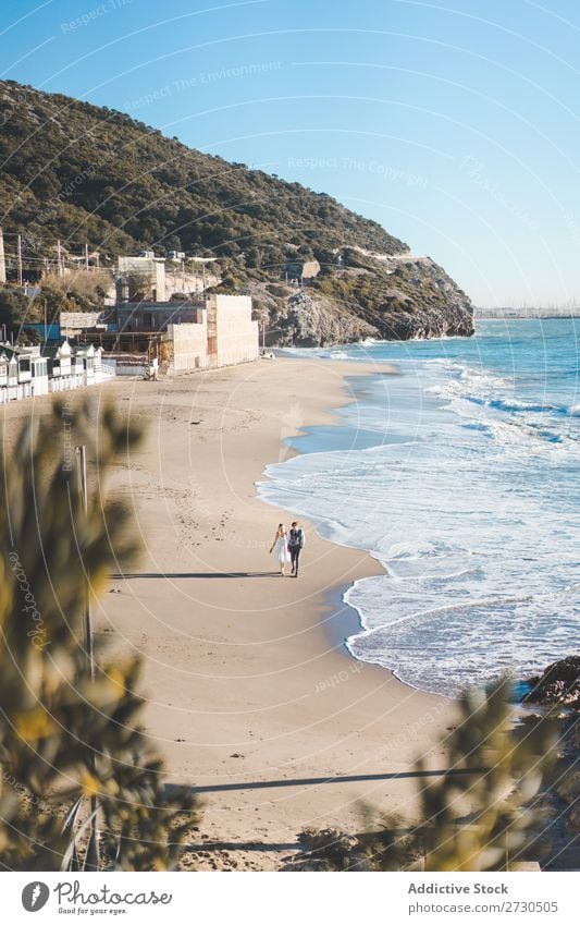 Romantic bride and groom strolling on beach Couple Bride Groom To go for a walk Beach Landscape Nature Promenade romantic Exterior shot seaside Together Love