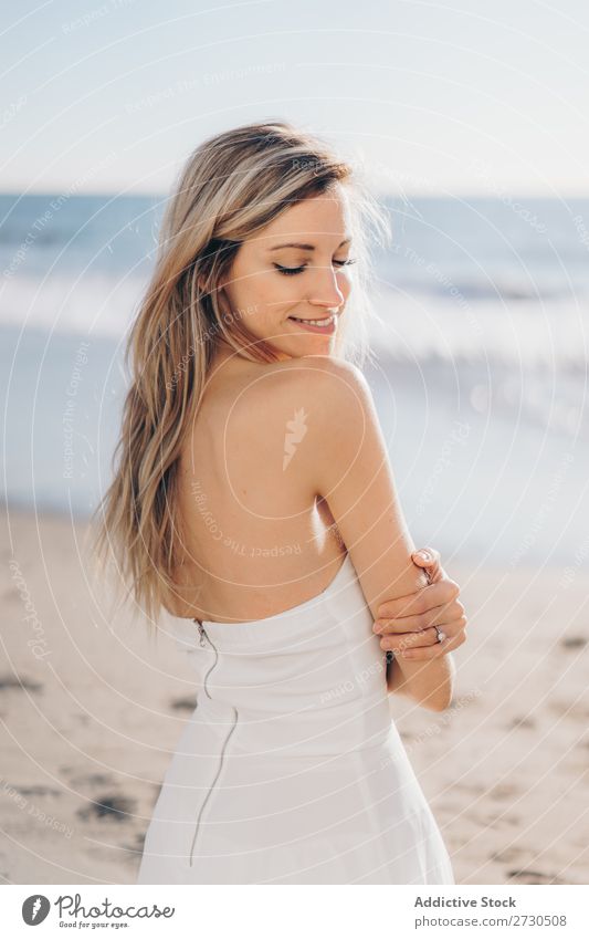 Tender girl in bridal dress on beach Woman Bride To enjoy Beach Sunlight Dress tenderness Youth (Young adults) in love Considerate Natural embracing human face