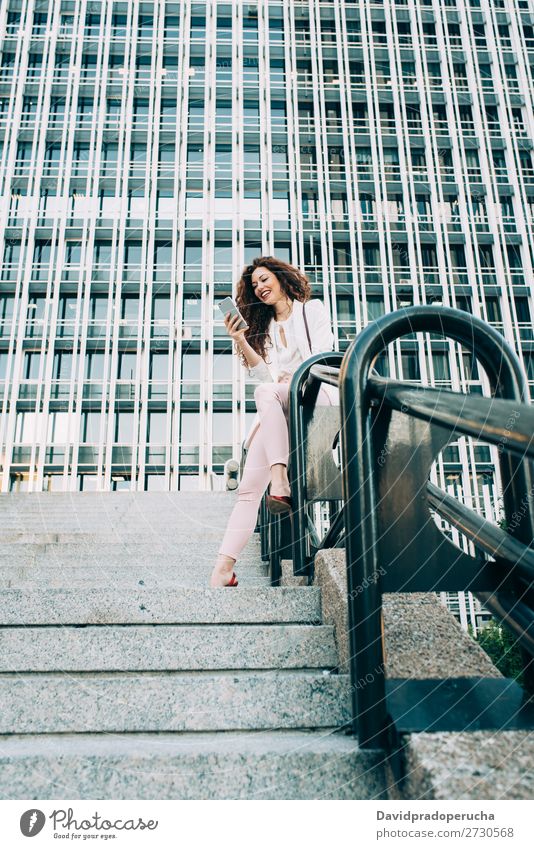 Young redhead business woman walking on the stairs Woman Red-haired Business Businesswoman Technology Work and employment Walking Stairs Suit Pink boss Lady