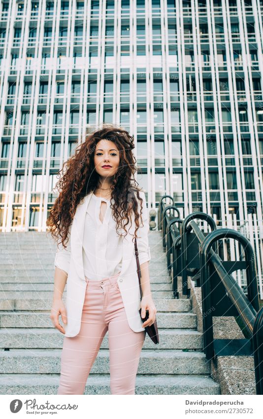 Young redhead business woman walking on the stairs Woman Red-haired Business Businesswoman Technology Work and employment Walking Stairs Suit Pink boss Lady