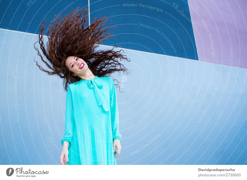 Happy beautiful young redhead woman posing by a colorful wall Woman Red-haired Smiling Face Beauty Photography Girl Ginger Curly Loneliness Portrait photograph