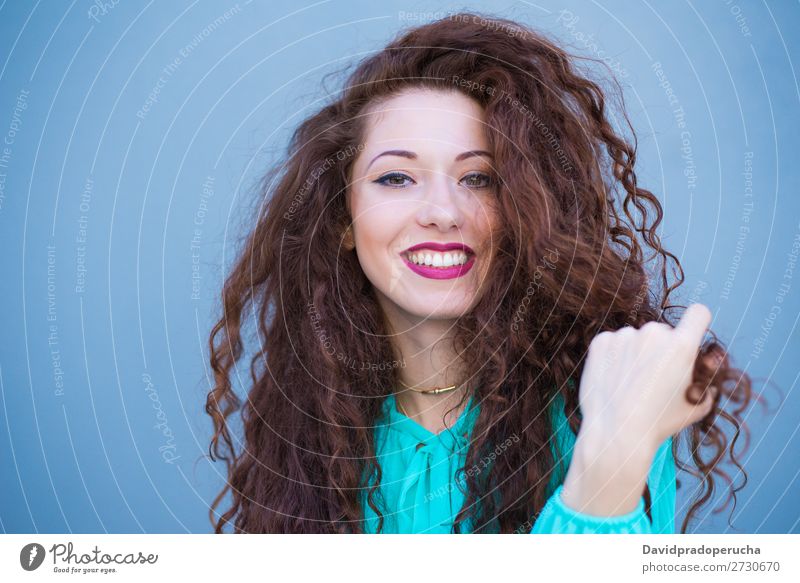 Portrait of a happy beautiful young redhead woman by a colorful wall Woman Red-haired Smiling Happy Face Beauty Photography Girl Ginger Curly Loneliness