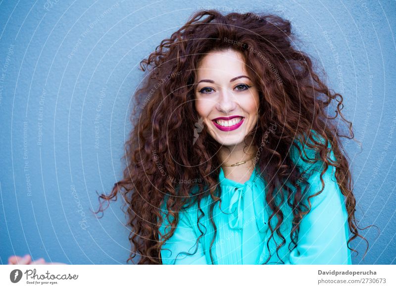 Portrait of a happy beautiful young redhead woman by a colorful wall Woman Red-haired Smiling Happy Face Beauty Photography Girl Ginger Curly Loneliness