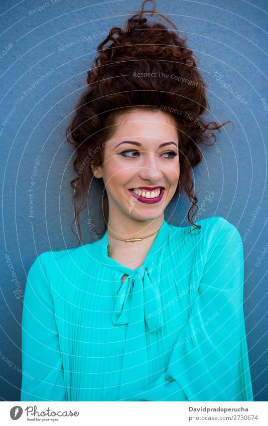 Portrait of a happy beautiful young redhead woman by a colorful wall Woman Red-haired Smiling Happy Face Beauty Photography Girl Ginger Curly Loneliness