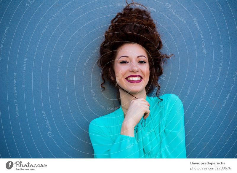 Portrait of a happy beautiful young redhead woman by a colorful wall Woman Red-haired Smiling Happy Face Beauty Photography Girl Ginger Curly Loneliness