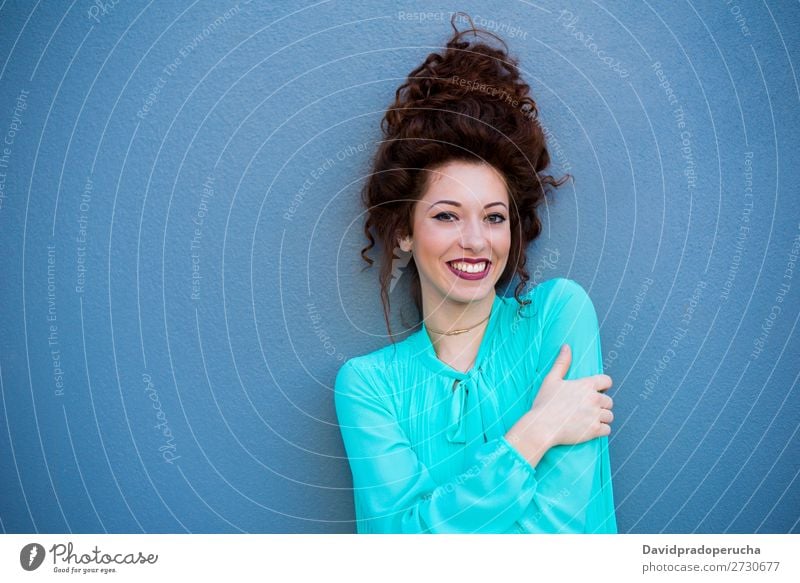 Portrait of a happy beautiful young redhead woman by a colorful wall Woman Red-haired Smiling Happy Face Beauty Photography Girl Ginger Curly Loneliness