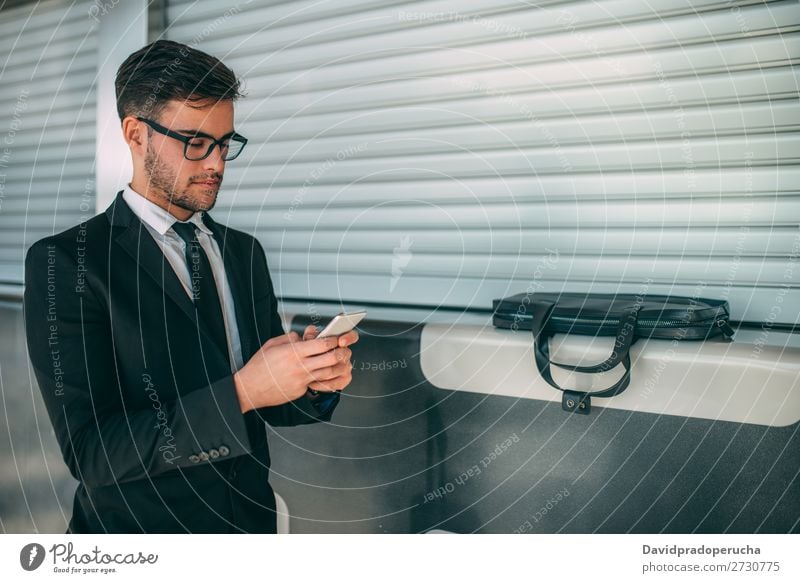 Young business man standing on the phone with the suitcase at the airport waiting for the flight Airport Man Vacation & Travel Mobile Telephone Communication