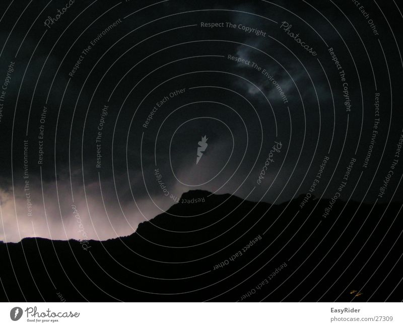 Lightning in the mountains Clouds Mountain Lamp Sky