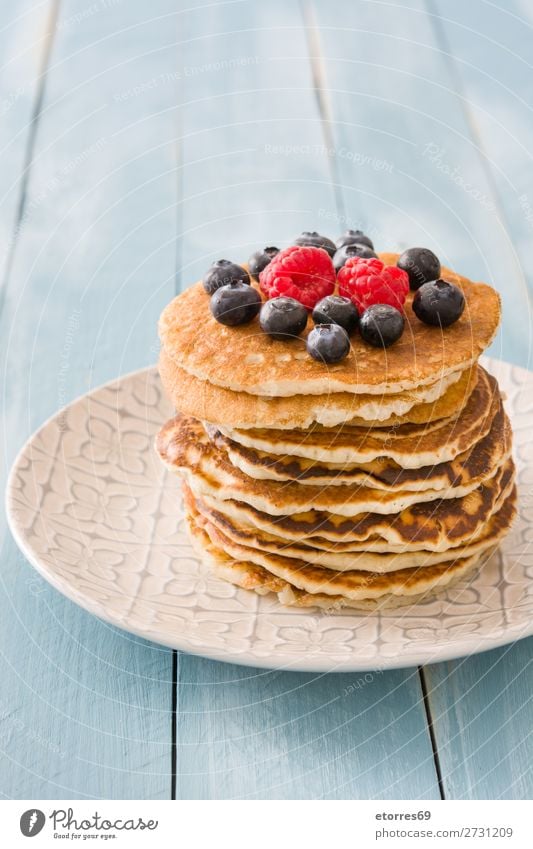 Pancakes with raspberries and blueberries Candy Dessert Breakfast Blueberry Raspberry Berries Red Baking Food Healthy Eating Food photograph Dish Plate isolated