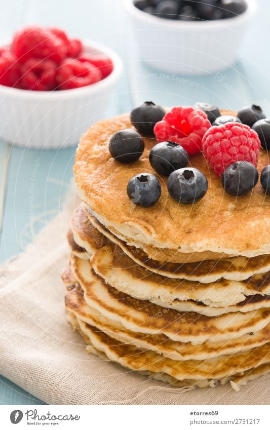 Pancakes with raspberries and blueberries Candy Dessert Breakfast Blueberry Raspberry Berries Red Baking Food Healthy Eating Food photograph Dish Plate isolated