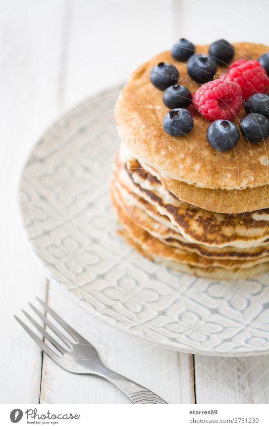 Pancakes with raspberries and blueberries Candy Dessert Breakfast Blueberry Raspberry Berries Red Baking Food Healthy Eating Food photograph Dish Plate isolated