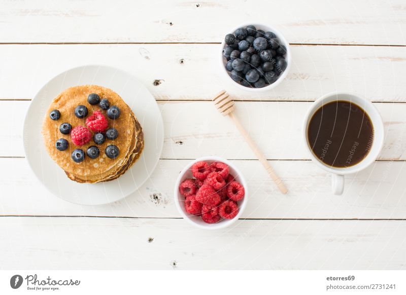 Pancakes with raspberries and blueberries Candy Dessert Breakfast Blueberry Raspberry Berries Red Baking Food Healthy Eating Food photograph Dish Plate isolated