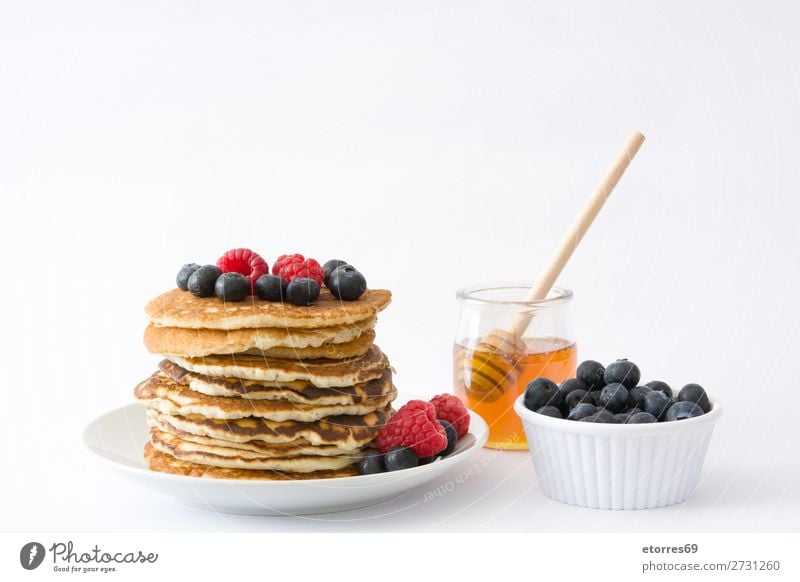 Pancakes with raspberries and blueberries Candy Dessert Breakfast Blueberry Raspberry Berries Red Baking Food Healthy Eating Food photograph Dish Plate isolated