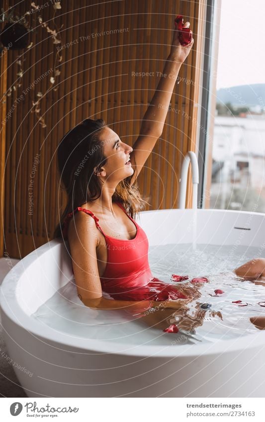 Woman in a modern bath tub Lifestyle Luxury Beautiful Body Skin Wellness Relaxation Spa Bathtub Bathroom Adults Flower To enjoy Modern Clean young girl Tub care