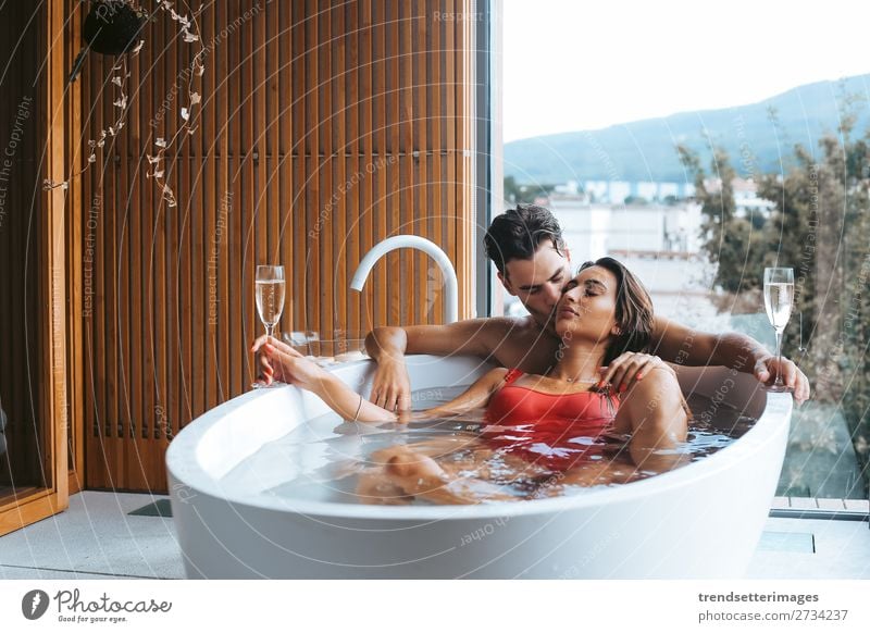 Couple enjoying a bath with champagne Alcoholic drinks Lifestyle Luxury Happy Beautiful Wellness Relaxation Spa Leisure and hobbies Vacation & Travel Woman