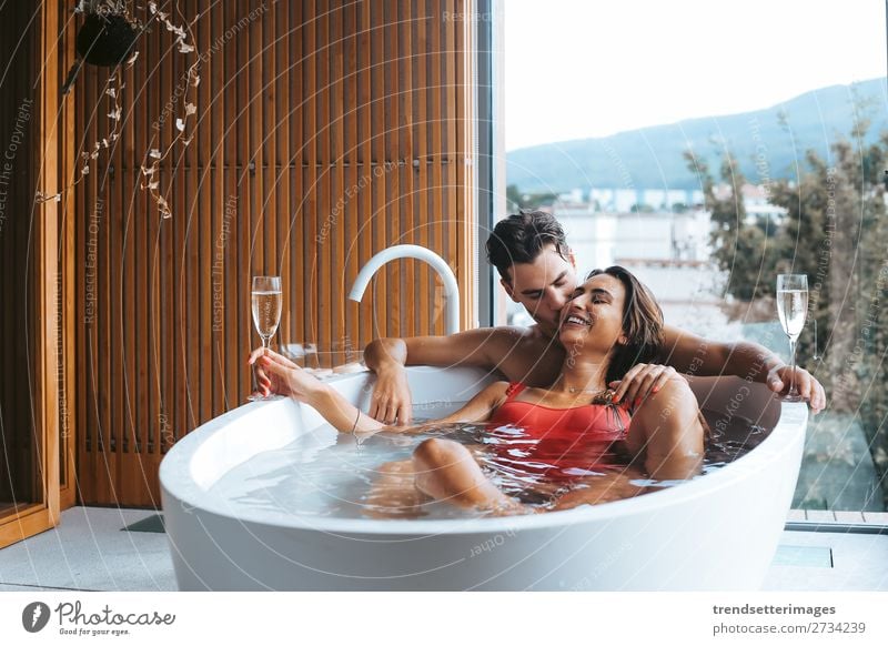 Couple enjoying a bath with champagne Alcoholic drinks Lifestyle Luxury Happy Beautiful Wellness Relaxation Spa Leisure and hobbies Vacation & Travel Woman