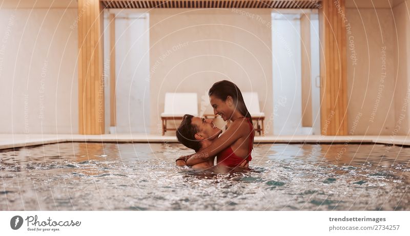 Couple In Love At Luxury Hotel Lifestyle Joy Happy Beautiful Wellness Relaxation Spa Swimming pool Leisure and hobbies Woman Adults Man Waterfall Smiling water