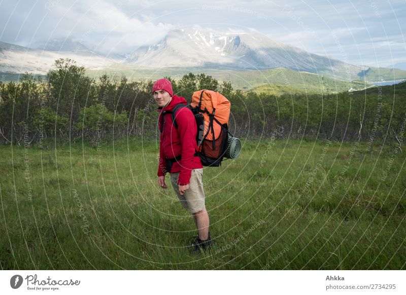 Young man with hiking backpack in nordic island landscape Vacation & Travel Mountain Hiking Human being Youth (Young adults) Norway Backpacking vacation Wild