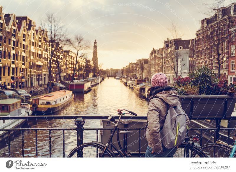 Woman looking at sunset at one of the canals in Amsterdam Vacation & Travel Tourism Trip Sightseeing City trip Feminine Young woman Youth (Young adults) 1