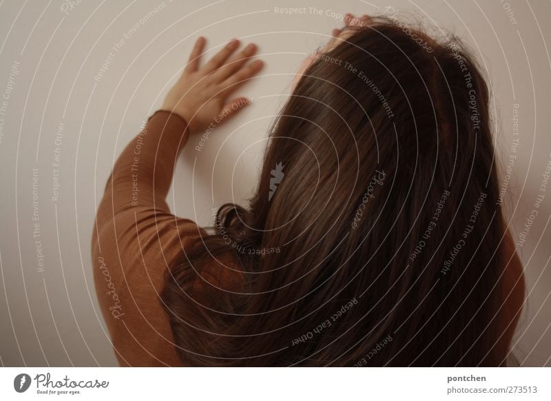 Brunette woman presses hands against the wall. Resistance. Way out. Hair and hairstyles sleeves by hand Human being Brown Pushing Wall (building) Upper body