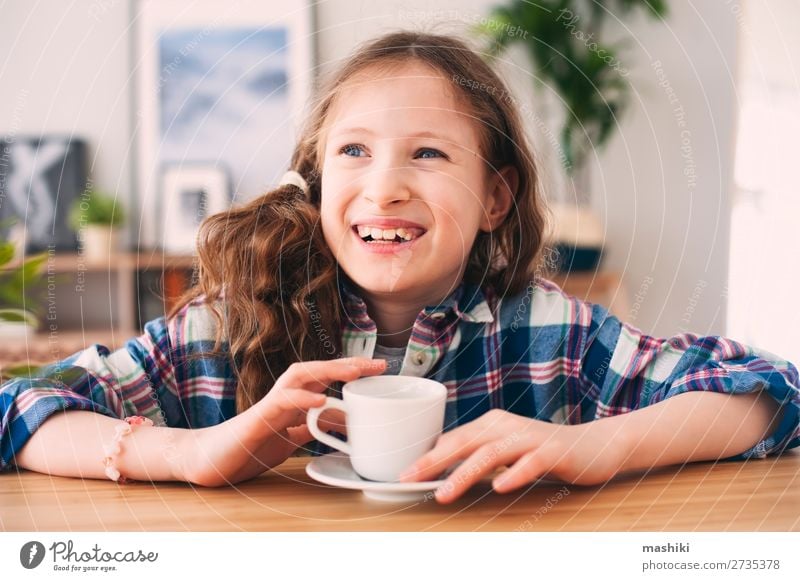 happy kid girl drinking tea for breakfast. Breakfast Hot Chocolate Tea Lifestyle Happy Relaxation Playing Kitchen Parenting Child Human being Infancy Warmth