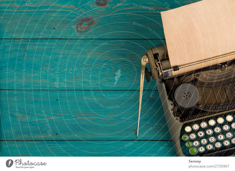 typewriter on the blue wooden desk Style Table Office Book Paper Wood Old Write Retro Blue Green Typewriter background vintage Writer machine Communication