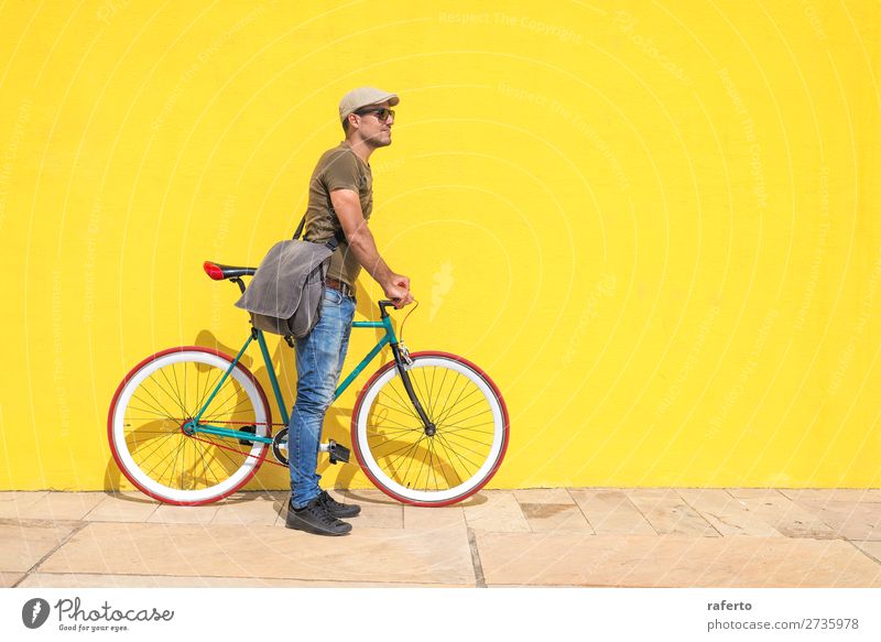 Side view of a young hipster man with a fixed bike Human being Masculine Young man Youth (Young adults) Man Adults 1 13 - 18 years 18 - 30 years Clothing