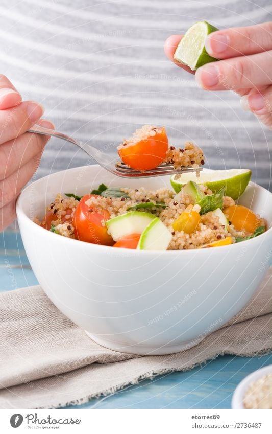 Woman eating quinoa and vegetables in bowl Vegan diet Vegetable Tomato Bowl Vegetarian diet Healthy Healthy Eating Diet Grain Preparation superfood Seed gluten