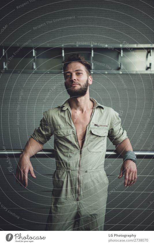 Portrait of a man in a jumpsuit Beautiful Body Calm Masculine Homosexual Man Adults Building Fashion Beard Metal Simple Eroticism Modern Gray White hair Khaki