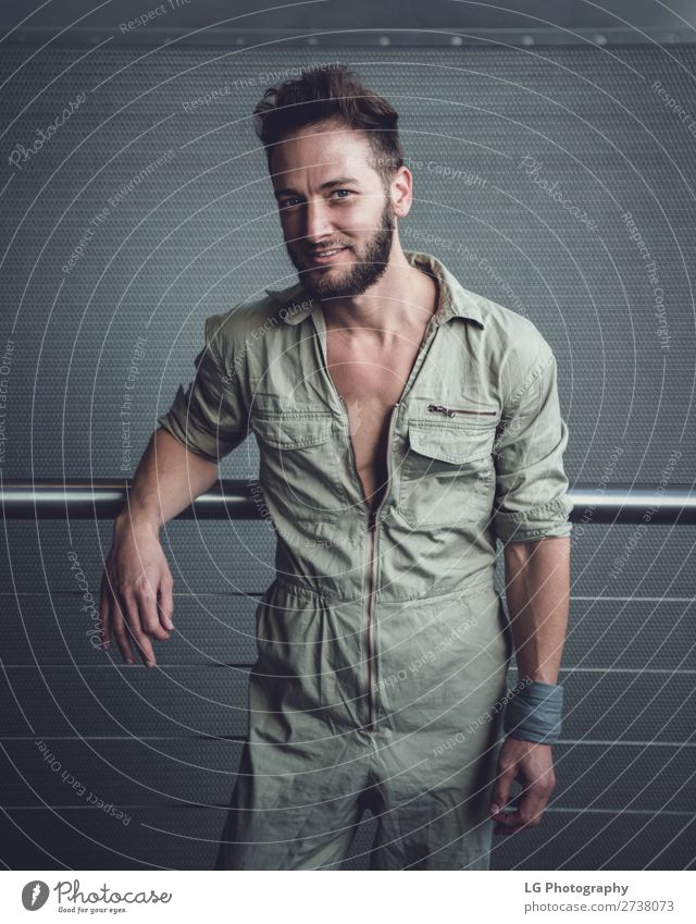 Portrait of a man in a jumpsuit Beautiful Body Calm Masculine Homosexual Man Adults Building Fashion Beard Metal Simple Eroticism Modern Gray White hair Khaki