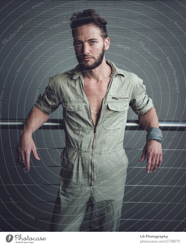 Portrait of a man in a jumpsuit Beautiful Body Calm Masculine Homosexual Man Adults Building Fashion Beard Metal Simple Eroticism Modern Gray White hair Khaki