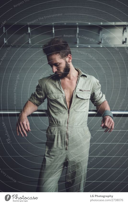 Portrait of a man in a jumpsuit Beautiful Body Calm Masculine Homosexual Man Adults Building Fashion Beard Metal Simple Eroticism Modern Gray White hair Khaki