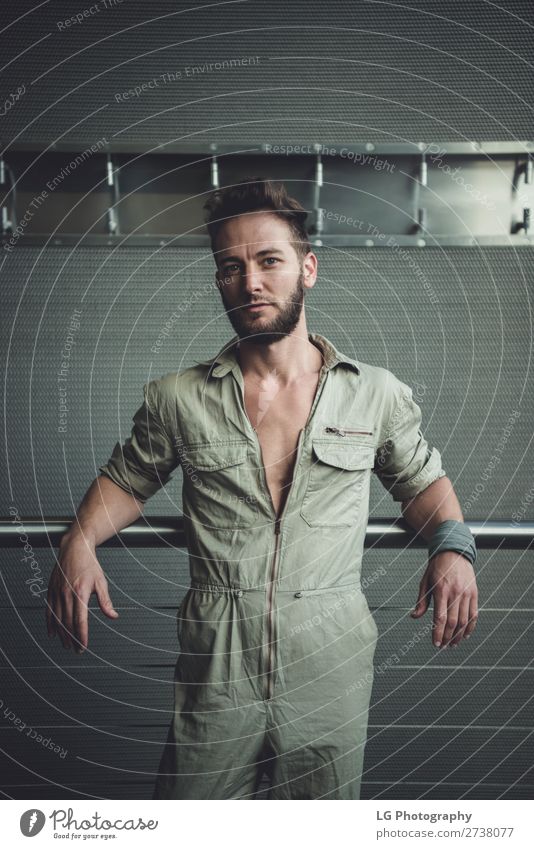 Portrait of a man in a jumpsuit Beautiful Body Calm Masculine Homosexual Man Adults Building Fashion Beard Metal Simple Eroticism Modern Gray White hair Khaki