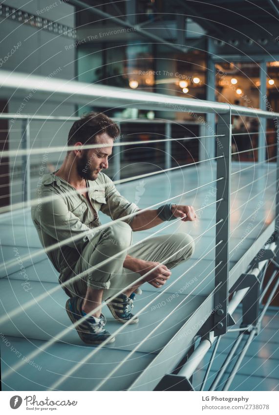 Portrait of a man in a jumpsuit Beautiful Body Masculine Homosexual Man Adults Building Fashion Beard Metal Simple Eroticism Modern Gray White fit one piece